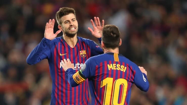 Gerard Pique e Lionel Messi.